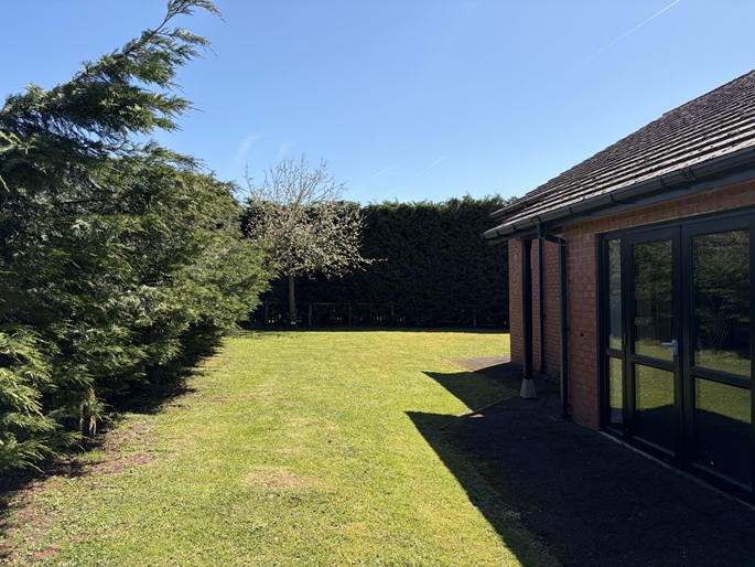 Grass outdoor area of the stoke lacy village hall